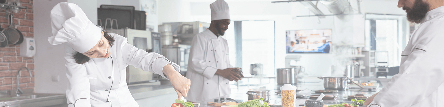 Professional chefs in Java Cuisine kitchen preparing authentic dishes